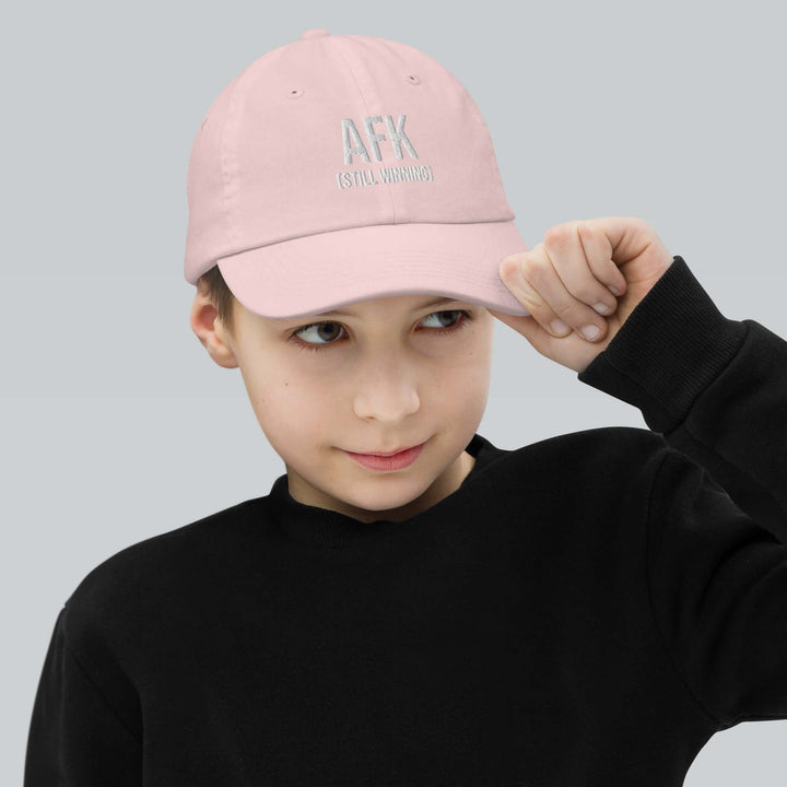 AFK Youth baseball cap worn by a child, featuring a stylish design and adjustable strap for a perfect fit.