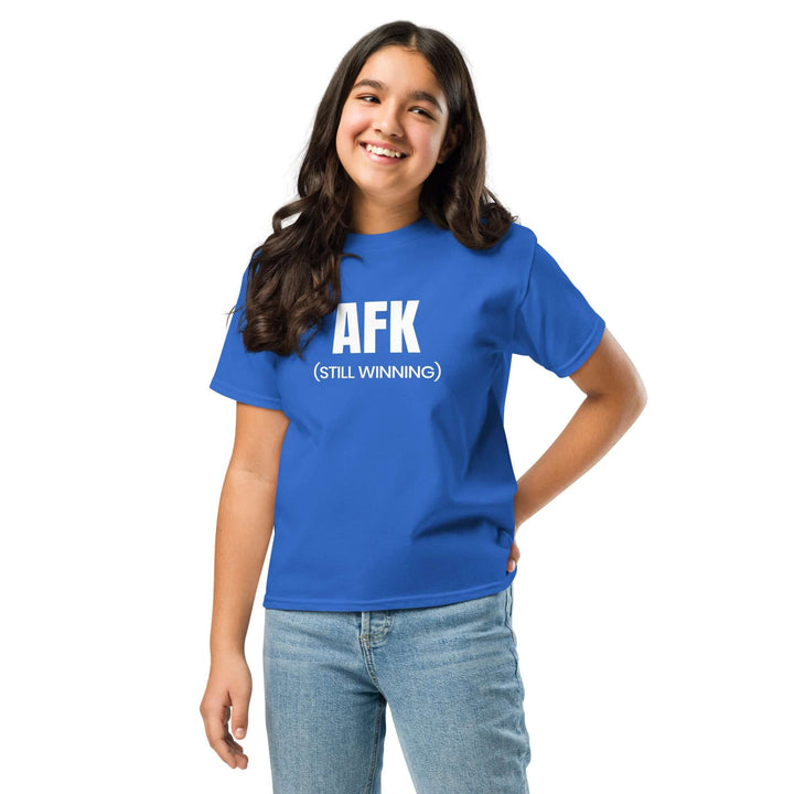 AFK Youth classic tee in blue worn by a girl smiling, showcasing its comfortable fit and fun design.