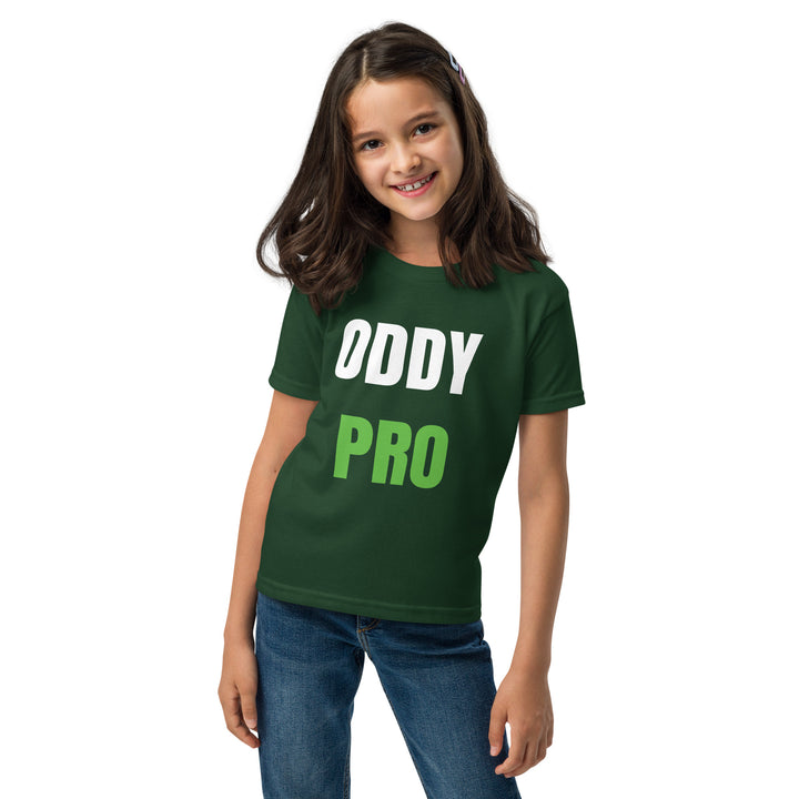 A girl wearing an Oddy Pro Youth t-shirt in green, showcasing its modern fit and moisture-wicking fabric.