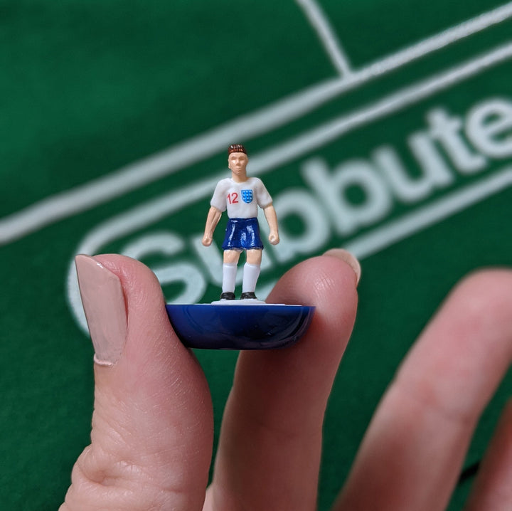 Subbuteo England Edition Main Game figurine depicting an England player in iconic football table setup.