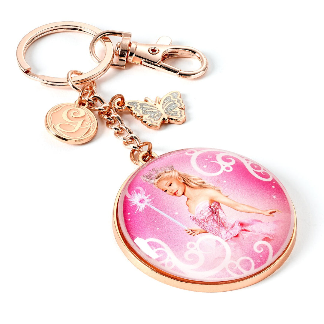 Wicked Glinda Bubble Keyring featuring Glinda in her bubble with rose gold charms and butterfly embellishment.