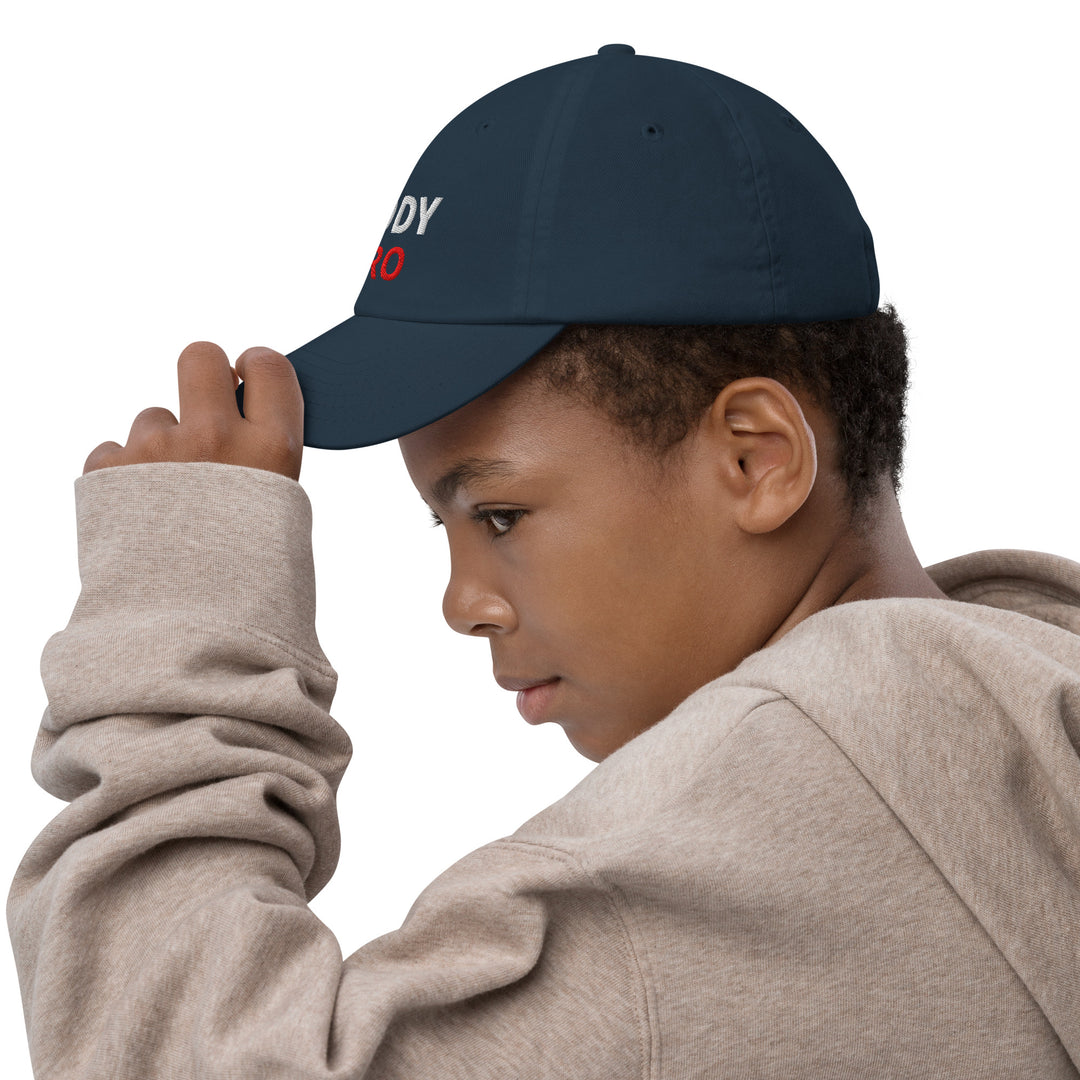 Oddy Pro Youth baseball cap worn by a child, showcasing its stylish design and adjustable fit.
